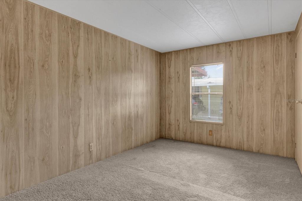 415 South Timber Trail Wildwood, FL 34785 - Photo 16 of 52 a view of an empty room with a window
