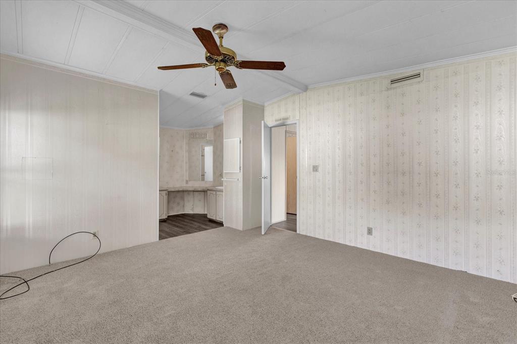 415 South Timber Trail Wildwood, FL 34785 - Photo 20 of 52 a view of empty room with ceiling fan
