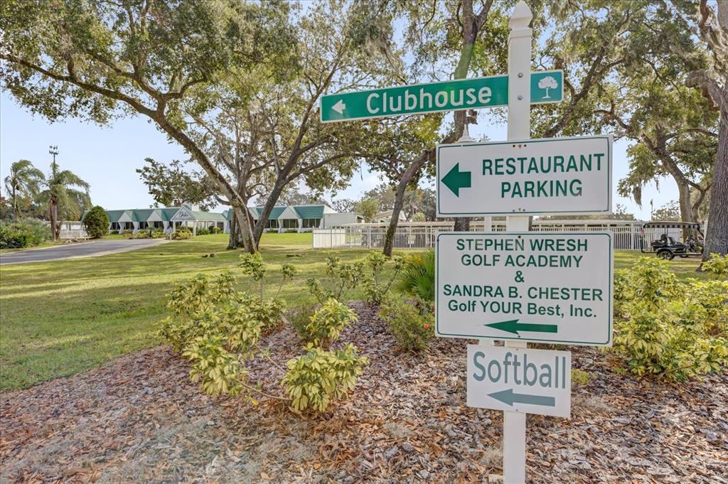 415 South Timber Trail Wildwood, FL 34785 - Photo 33 of 52 a view of a street sign under a large tree