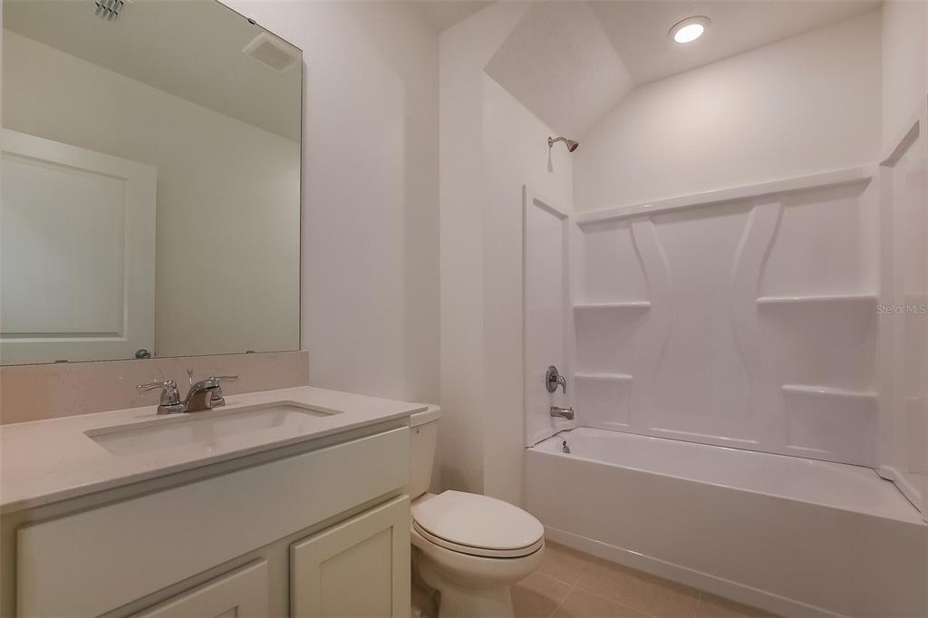 3608 Rolling Rdg Bend Davenport, FL 33837 - Photo 13 of 21 a bathroom with a sink toilet vanity and shower