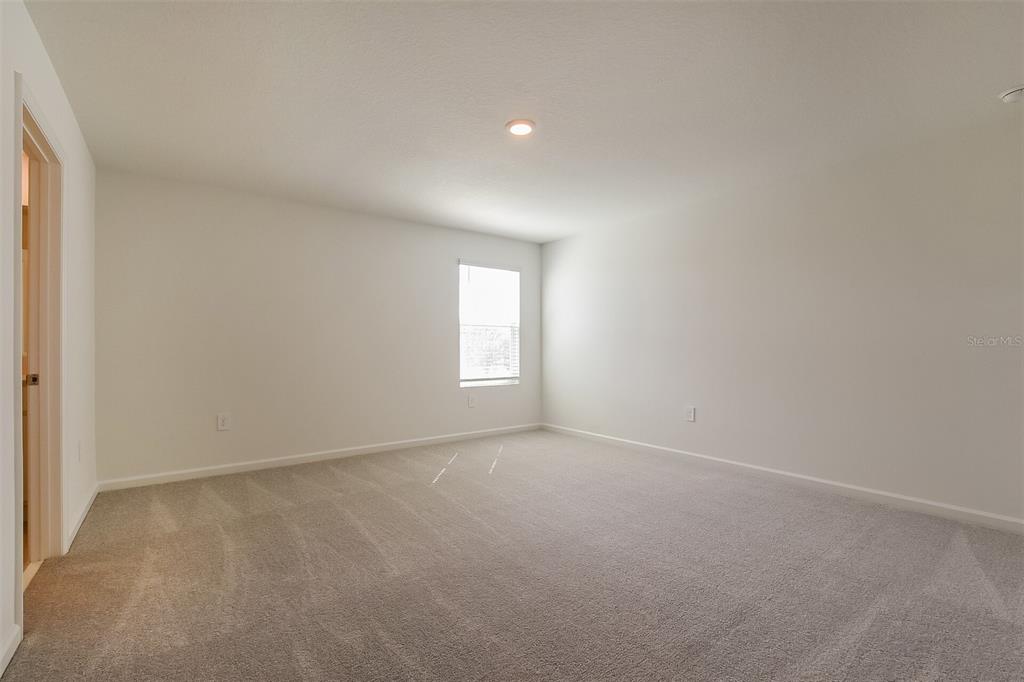 3608 Rolling Rdg Bend Davenport, FL 33837 - Photo 5 of 21 a view of an empty room with a window