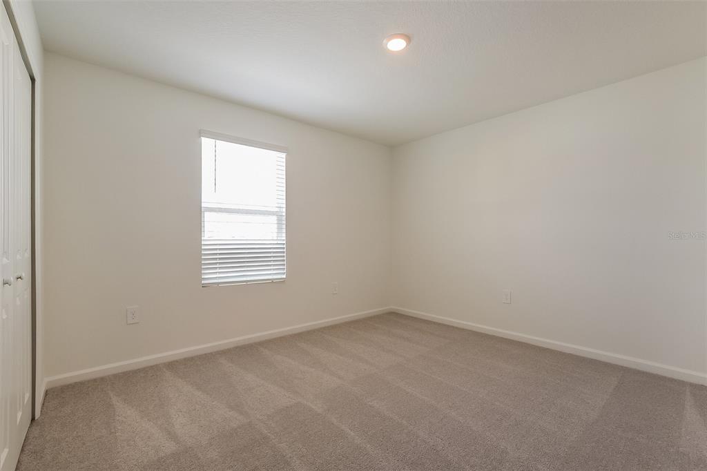 3608 Rolling Rdg Bend Davenport, FL 33837 - Photo 8 of 21 an empty room with a window