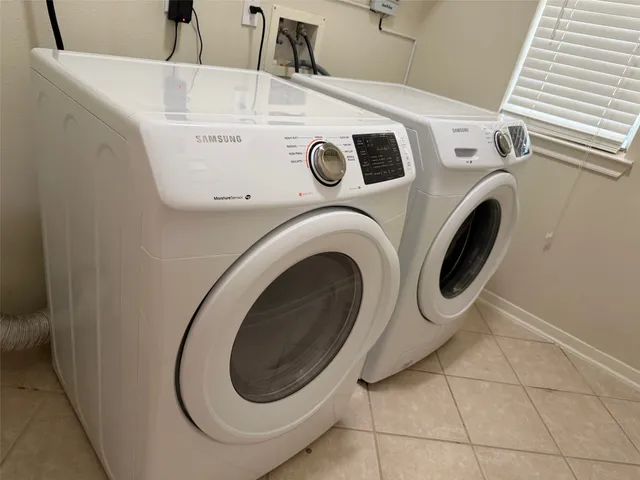 a utility room with dryer and washer