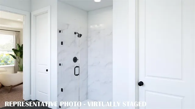 a picture of a bathroom with a shower