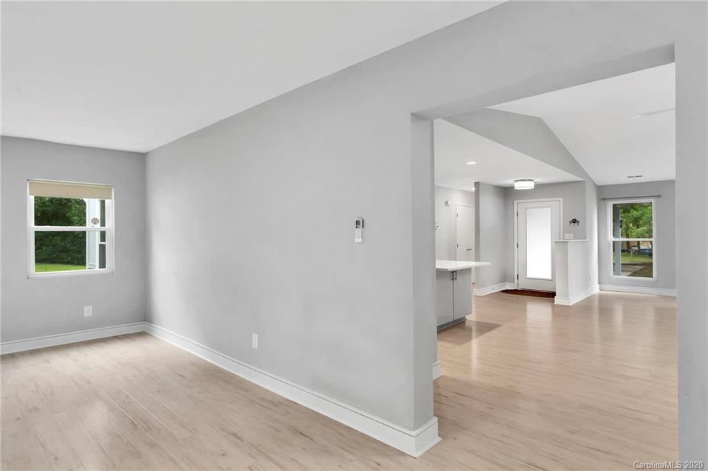 6200 Ropley Court Charlotte, NC 28211 - Photo 15 of 30 an empty room with wooden floor and windows