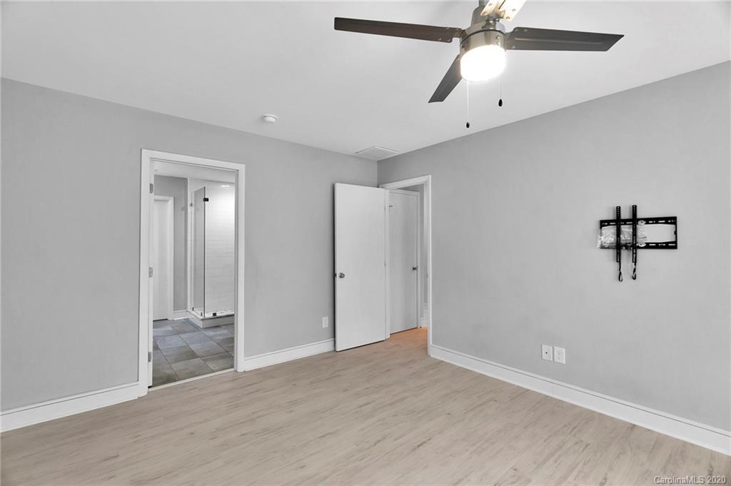 6200 Ropley Court Charlotte, NC 28211 - Photo 17 of 30 an empty room with fan and windows