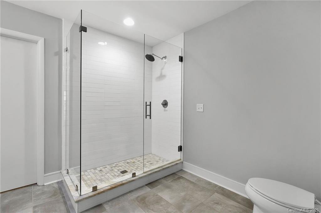 6200 Ropley Court Charlotte, NC 28211 - Photo 18 of 30 a bathroom with a shower and a toilet