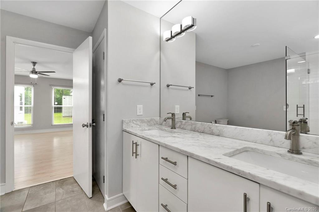 6200 Ropley Court Charlotte, NC 28211 - Photo 20 of 30 a bathroom with a granite countertop sink and a mirror
