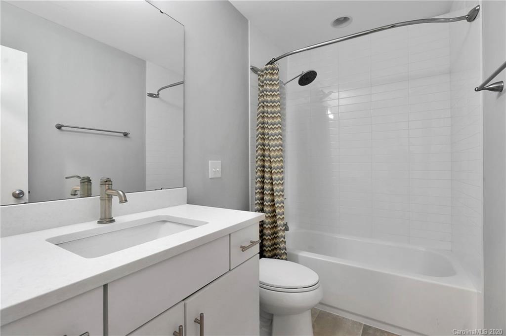 6200 Ropley Court Charlotte, NC 28211 - Photo 24 of 30 a bathroom with a sink a toilet and shower