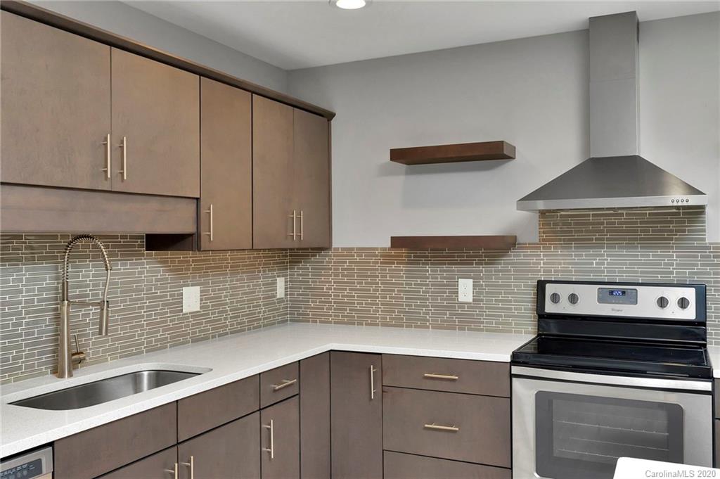 6200 Ropley Court Charlotte, NC 28211 - Photo 6 of 30 a kitchen with a sink and cabinets