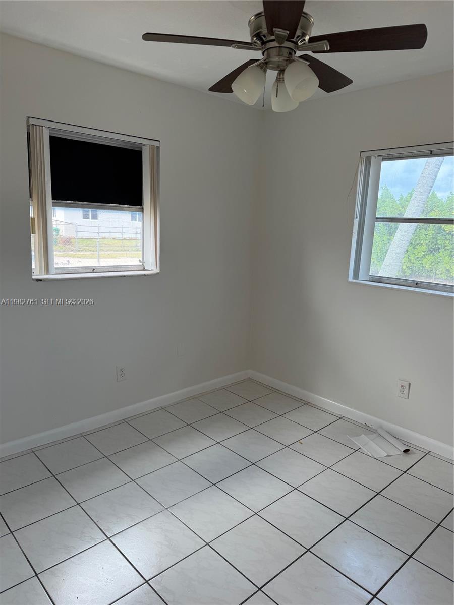 14865 Southwest 302nd Street Homestead, FL 33033 - Photo 11 of 18 a view of an empty room with a window