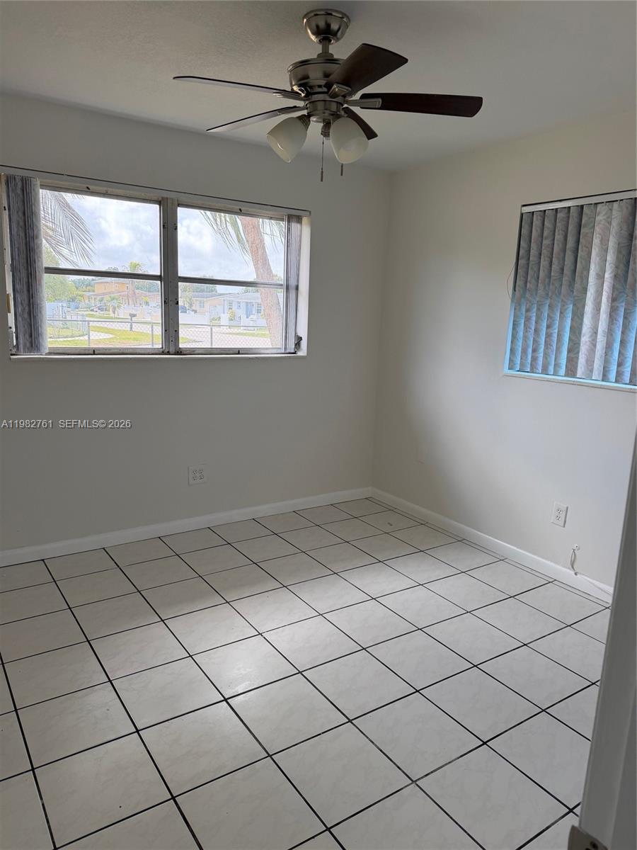 14865 Southwest 302nd Street Homestead, FL 33033 - Photo 12 of 18 a view of an empty room and window