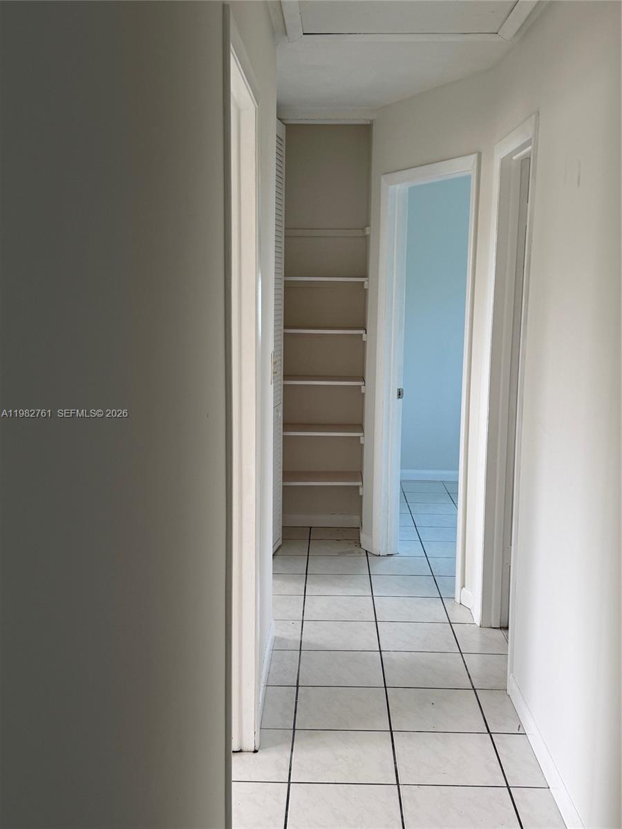 14865 Southwest 302nd Street Homestead, FL 33033 - Photo 13 of 18 a view of an empty walk in closet