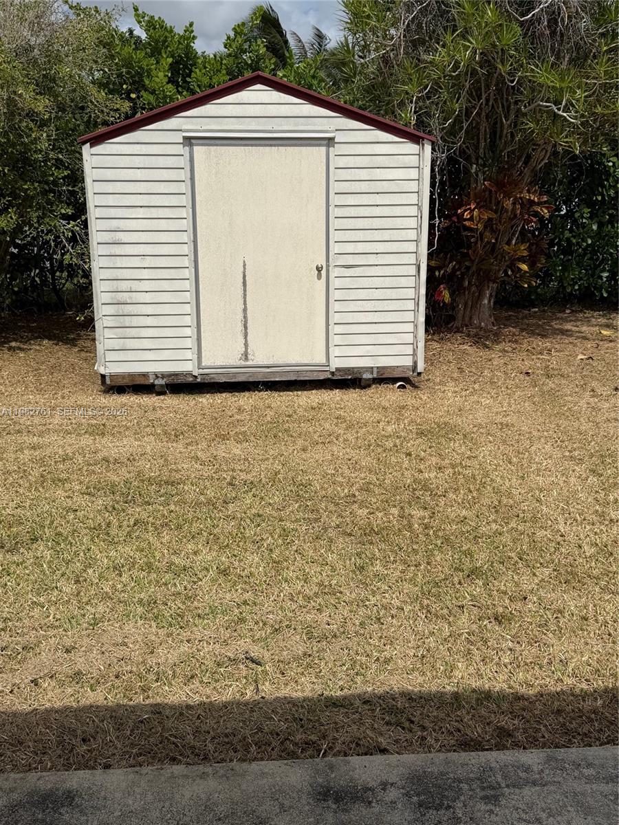 14865 Southwest 302nd Street Homestead, FL 33033 - Photo 14 of 18 a view of a garage