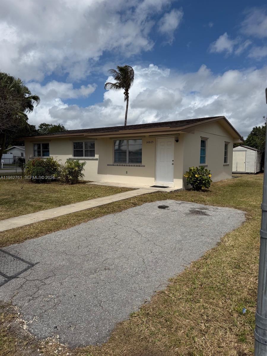 14865 Southwest 302nd Street Homestead, FL 33033 - Photo 2 of 18 a house view with a backyard space