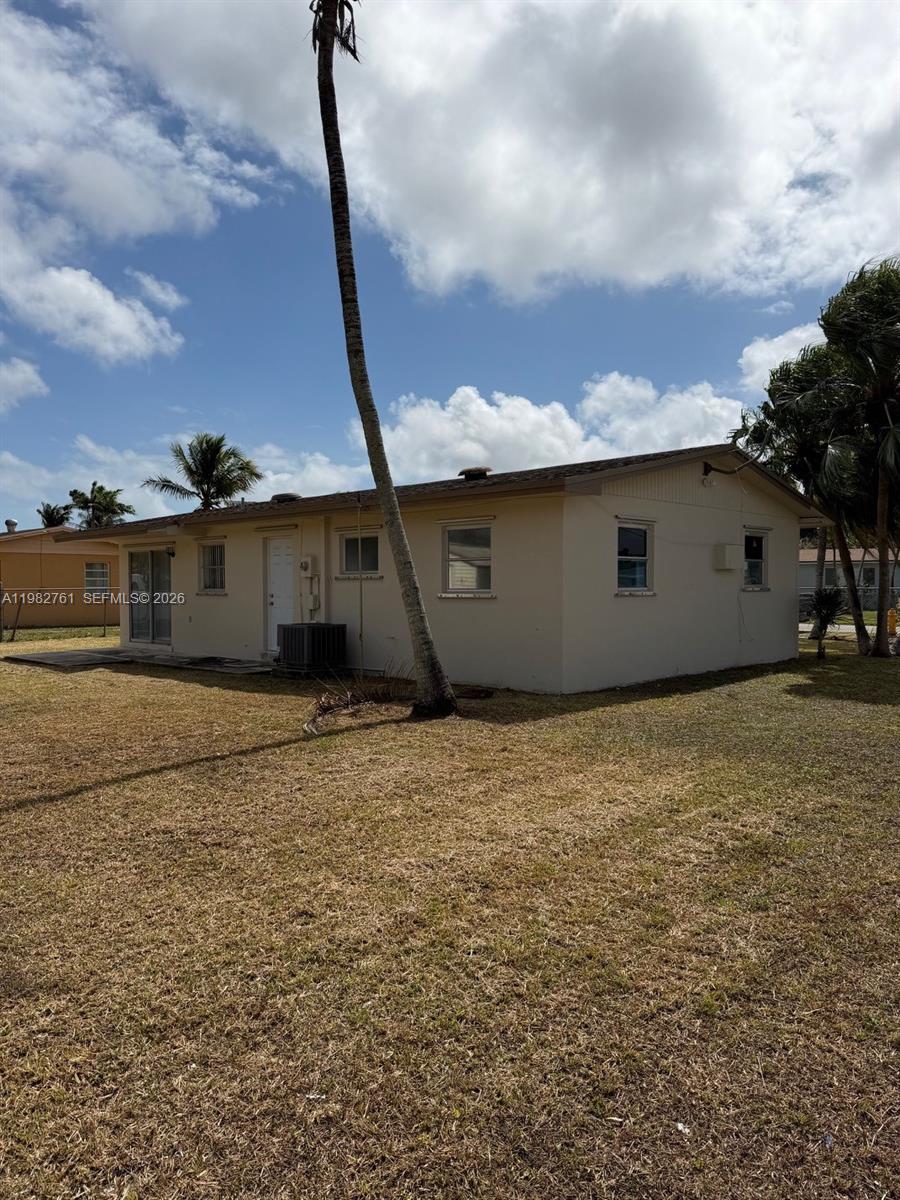 14865 Southwest 302nd Street Homestead, FL 33033 - Photo 3 of 18 a house view with a backyard
