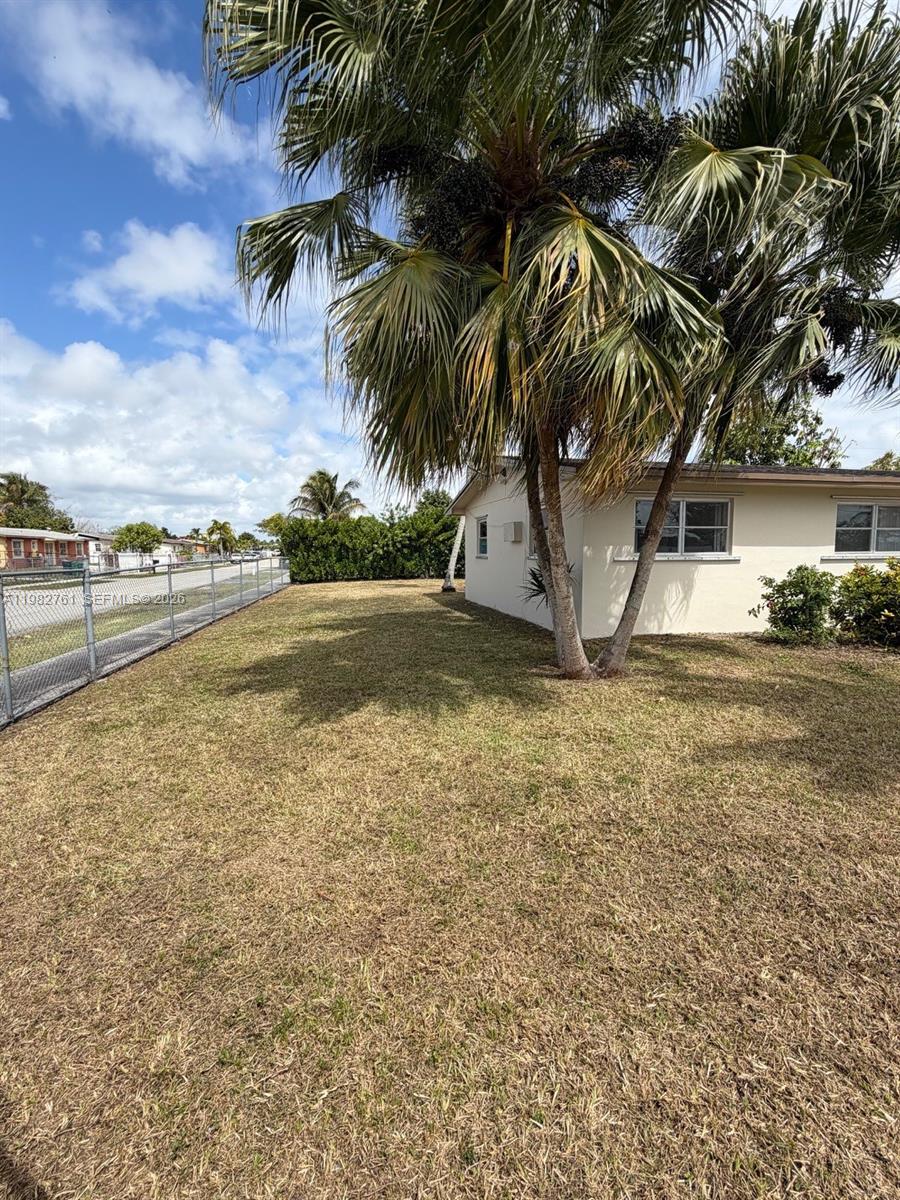 14865 Southwest 302nd Street Homestead, FL 33033 - Photo 4 of 18 a view of a yard with palm trees