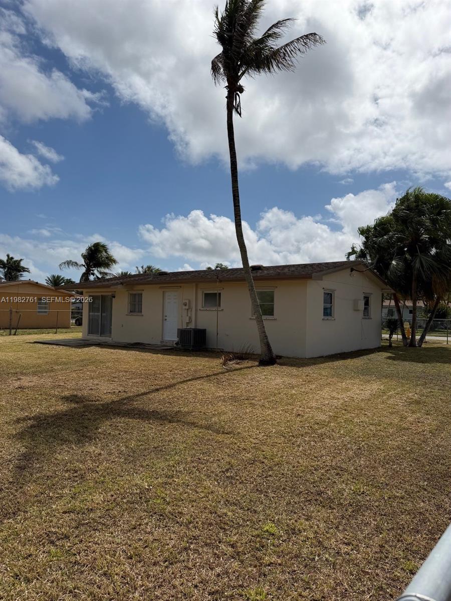 14865 Southwest 302nd Street Homestead, FL 33033 - Photo 7 of 18 a street view with beach