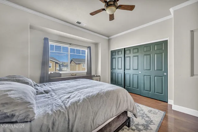 a bedroom with a large bed and a window