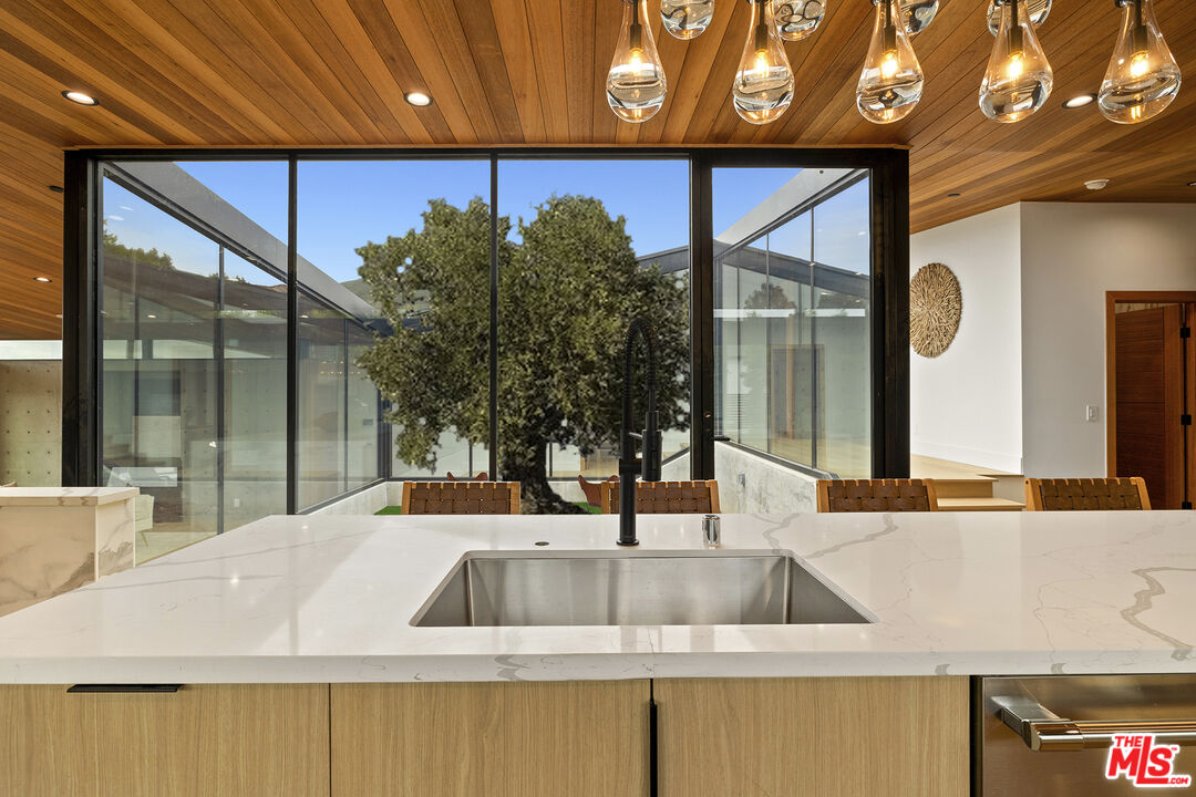5707 Busch Drive Malibu, CA 90265 - Photo 14 of 35 a kitchen with a sink and large window