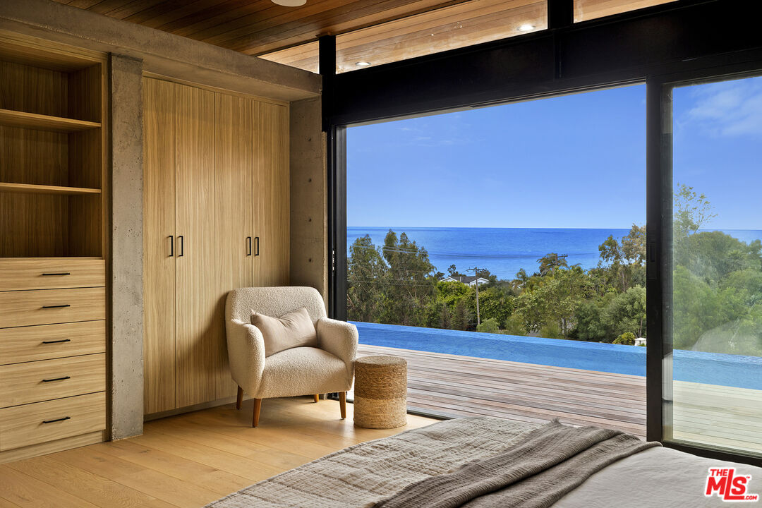 5707 Busch Drive Malibu, CA 90265 - Photo 16 of 35 a view of a chair and table in the balcony