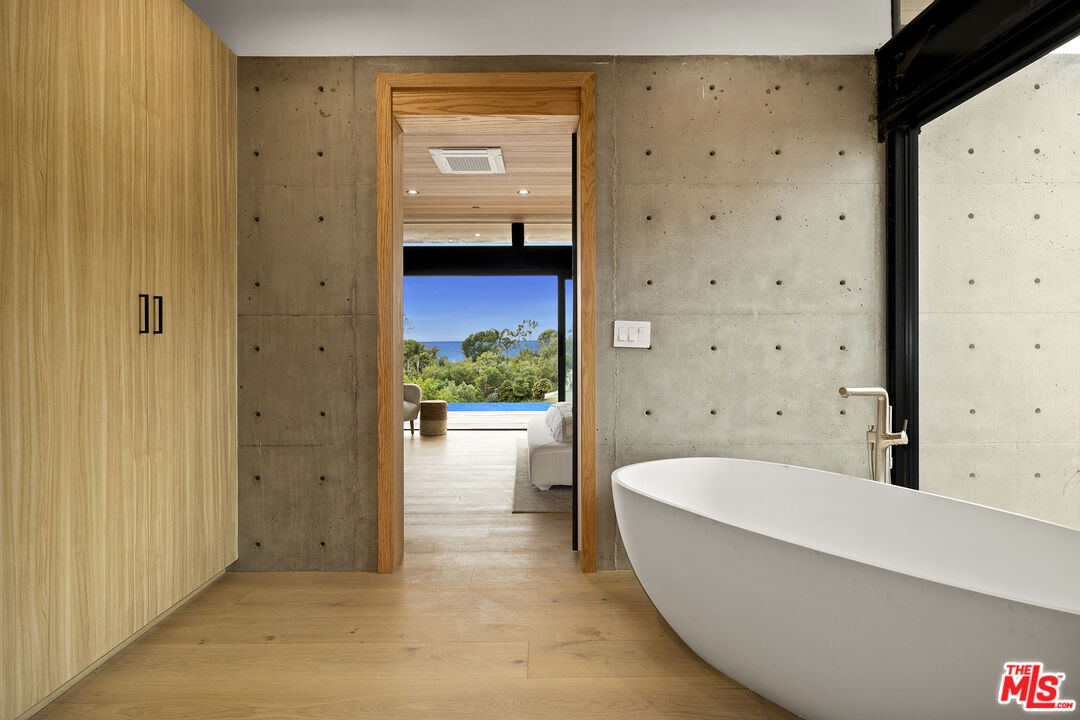 5707 Busch Drive Malibu, CA 90265 - Photo 19 of 35 a bathroom with a bathtub and a shower