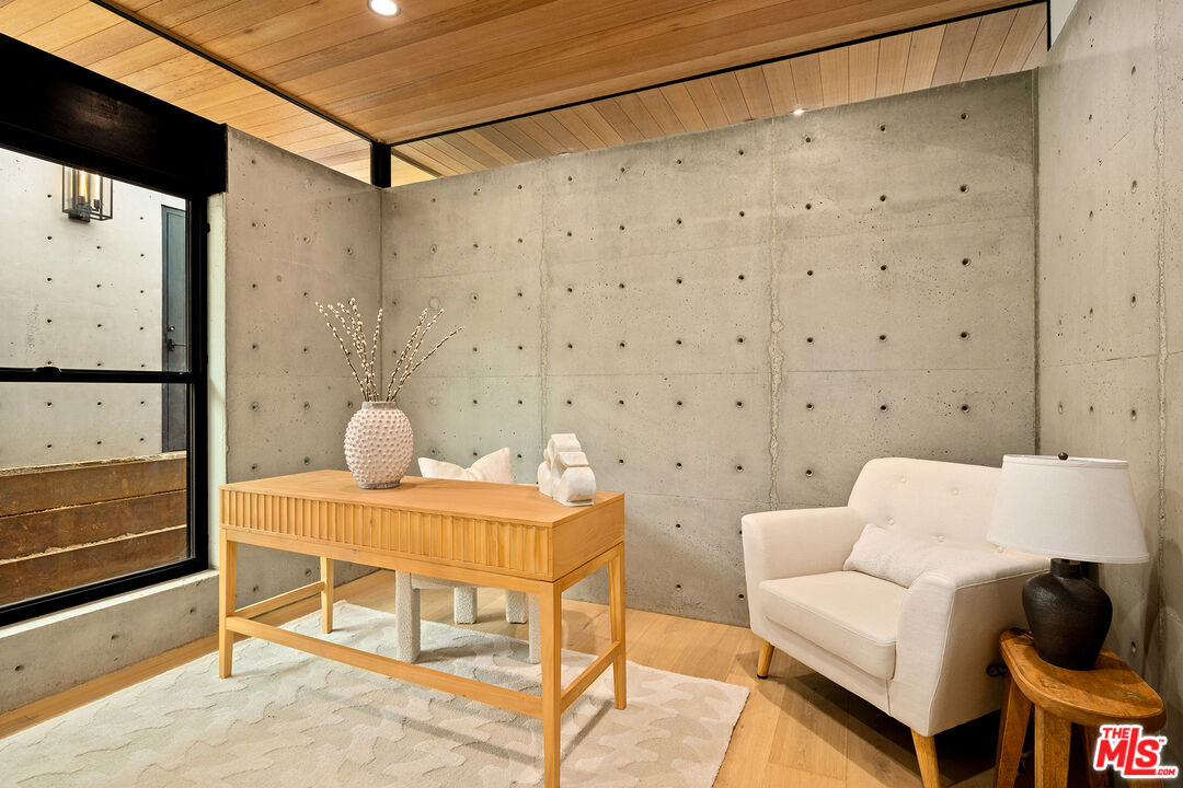 5707 Busch Drive Malibu, CA 90265 - Photo 23 of 35 a living room with a couch and a flat screen tv