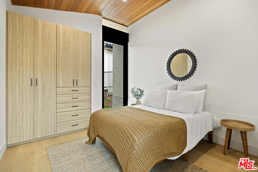 5707 Busch Drive Malibu, CA 90265 - Photo 25 of 35 a bedroom with a bed and closet