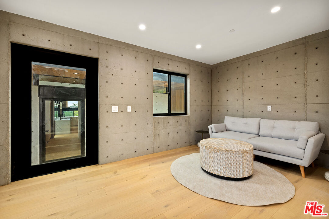 5707 Busch Drive Malibu, CA 90265 - Photo 27 of 35 a living room with furniture and a fireplace