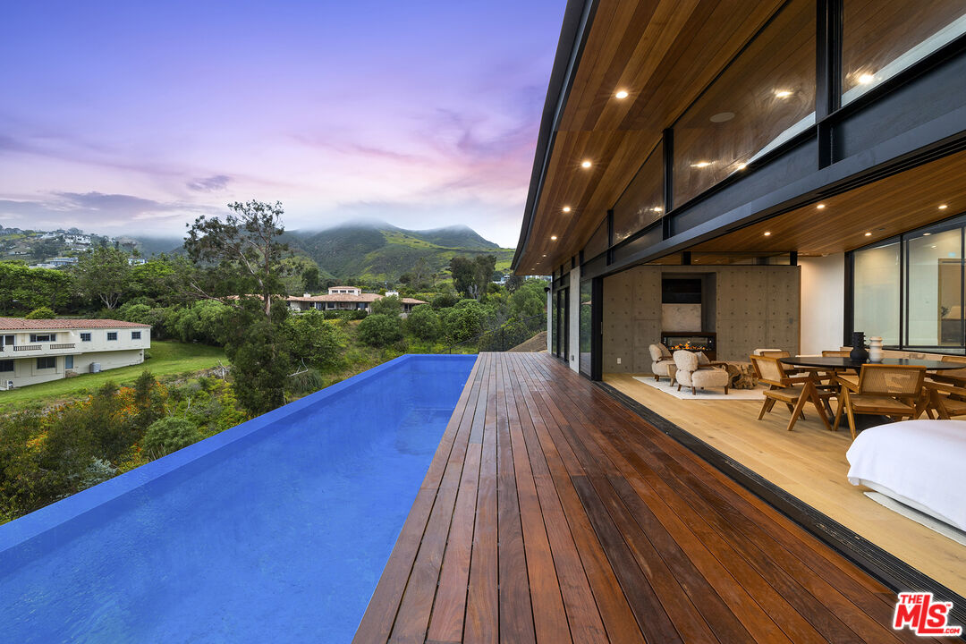 5707 Busch Drive Malibu, CA 90265 - Photo 31 of 35 a view of a house with a yard