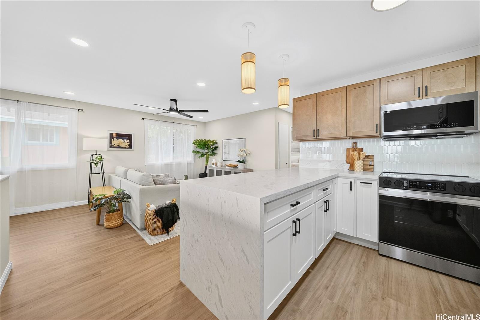 a kitchen with a sink and a stove top oven