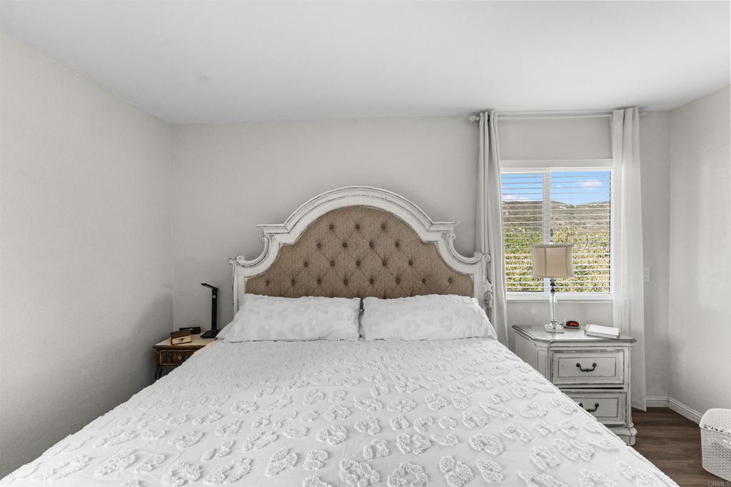 3340 Skytrail Ranch Road Jamul, CA 91935 - Photo 16 of 38 a bedroom with a bed and a window