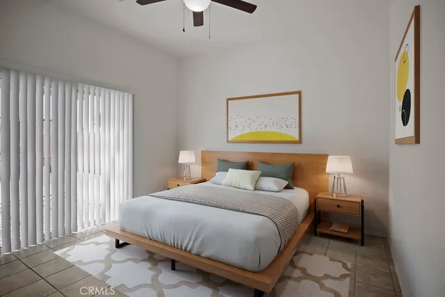 a bedroom with a bed and a painting on the wall