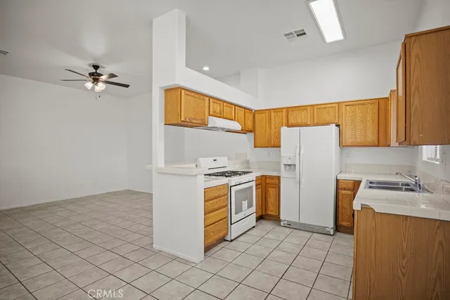 a view of a large building with a door and garden