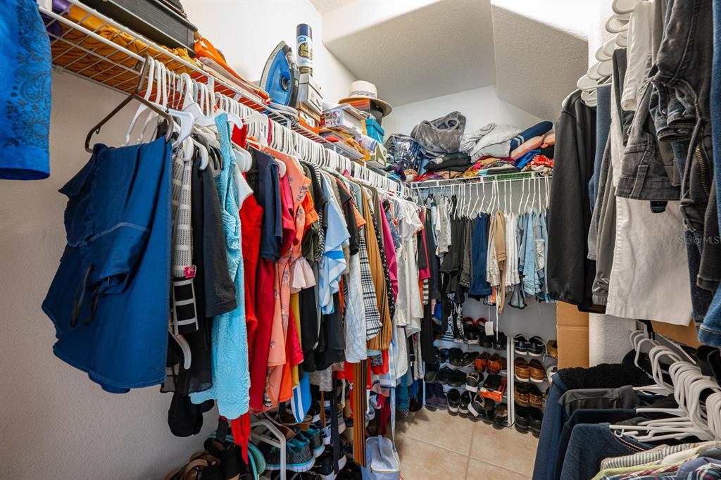700 Seabrook Court, Unit 201 Altamonte Springs, FL 32714 - Photo 17 of 32 a view of walk in closet with clothes