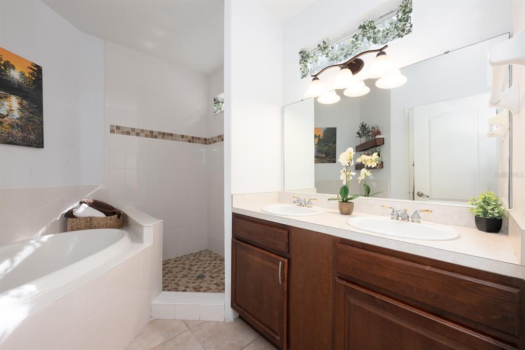 700 Seabrook Court, Unit 201 Altamonte Springs, FL 32714 - Photo 18 of 32 a bathroom with a sink a vanity and a mirror