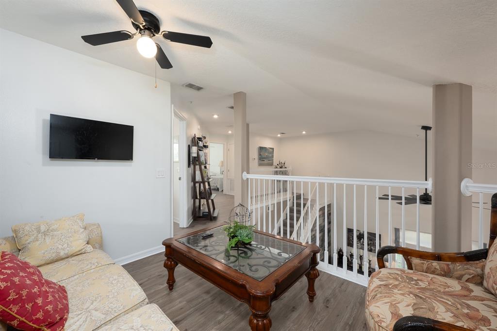 700 Seabrook Court, Unit 201 Altamonte Springs, FL 32714 - Photo 21 of 32 a living room with furniture and a flat screen tv