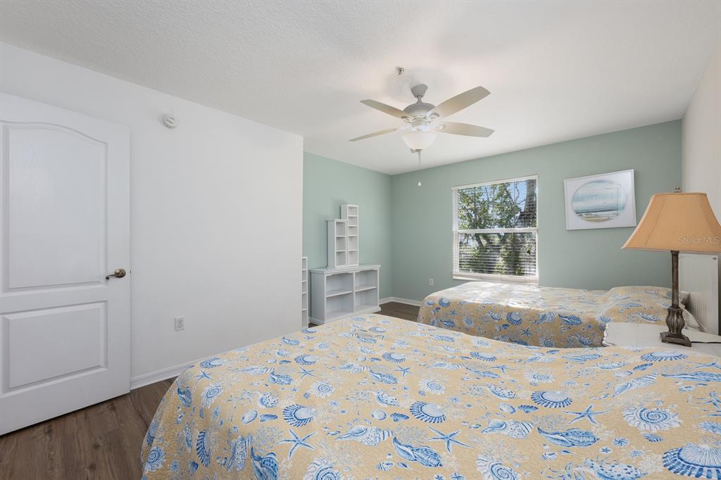 700 Seabrook Court, Unit 201 Altamonte Springs, FL 32714 - Photo 24 of 32 a bedroom with a bed and a lamp