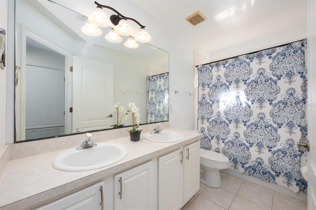 700 Seabrook Court, Unit 201 Altamonte Springs, FL 32714 - Photo 25 of 32 a bathroom with a sink and a mirror