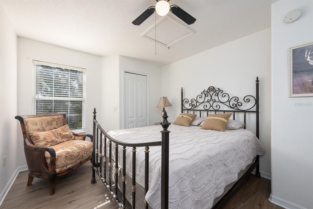 700 Seabrook Court, Unit 201 Altamonte Springs, FL 32714 - Photo 26 of 32 a bedroom with a bed and wooden floor