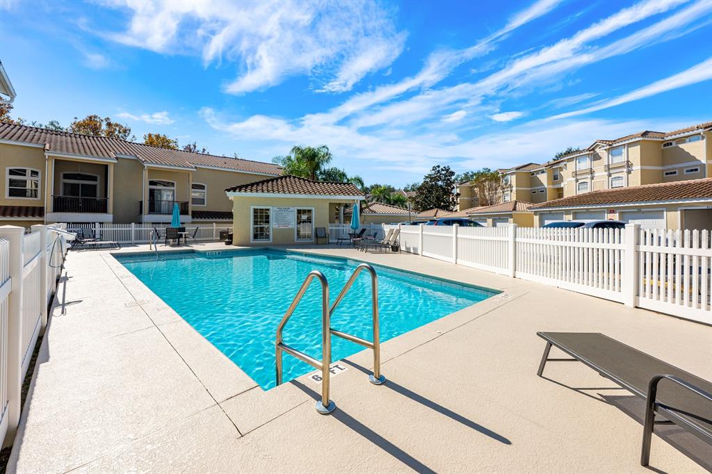 700 Seabrook Court, Unit 201 Altamonte Springs, FL 32714 - Photo 31 of 32 a view of a swimming pool with a lounge chairs