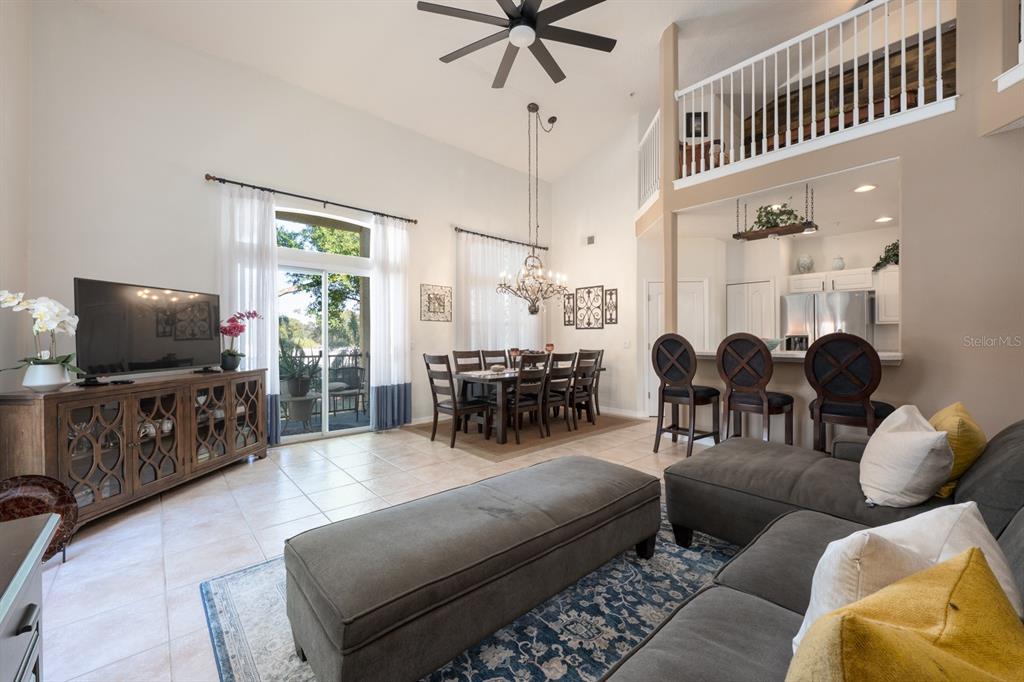 700 Seabrook Court, Unit 201 Altamonte Springs, FL 32714 - Photo 4 of 32 a living room with furniture and a flat screen tv