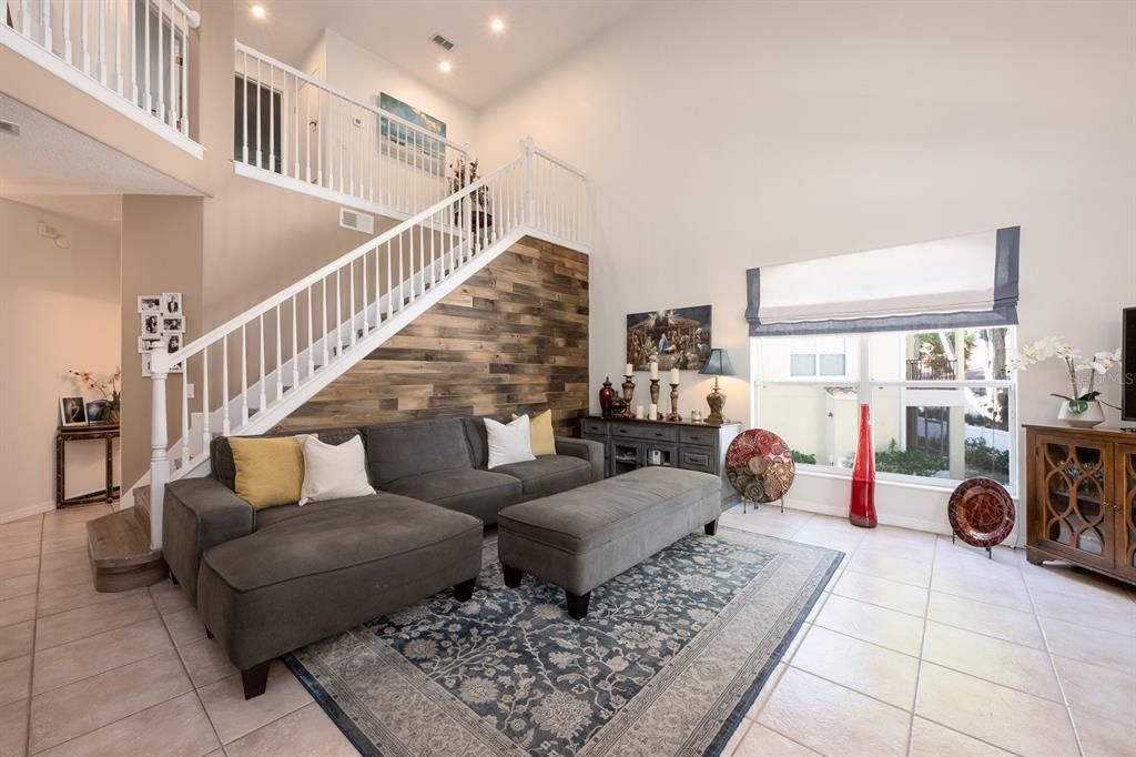 700 Seabrook Court, Unit 201 Altamonte Springs, FL 32714 - Photo 5 of 32 a living room with furniture a rug and a table