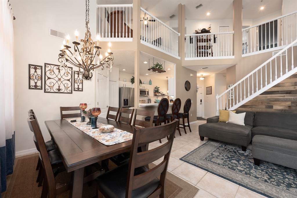 700 Seabrook Court, Unit 201 Altamonte Springs, FL 32714 - Photo 8 of 32 a view of a dining room with furniture and a rug