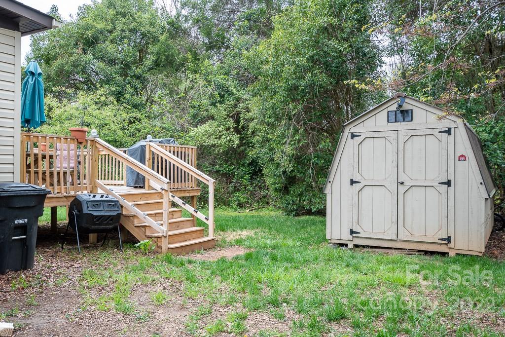 626 Westside Terrace, Unit 5 Davidson, NC 28036 - Photo 16 of 24 a front view of a house with garden