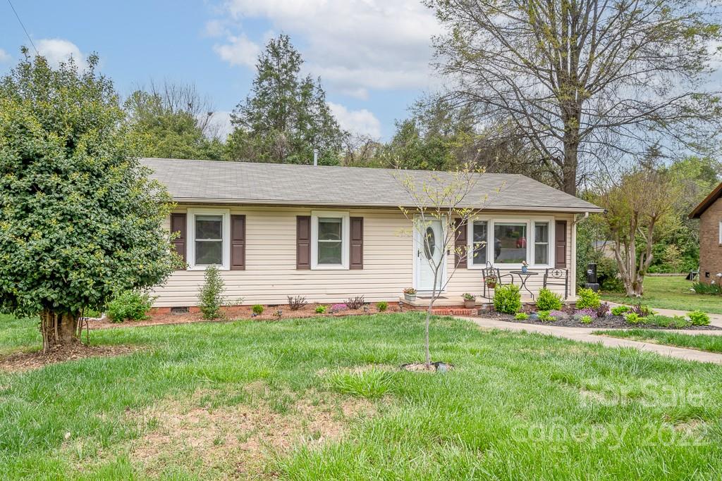 626 Westside Terrace, Unit 5 Davidson, NC 28036 - Photo 23 of 24 a front view of house with a garden and trees