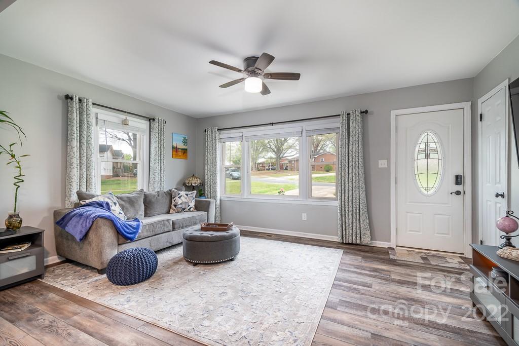 626 Westside Terrace, Unit 5 Davidson, NC 28036 - Photo 5 of 24 a living room with furniture and a large window