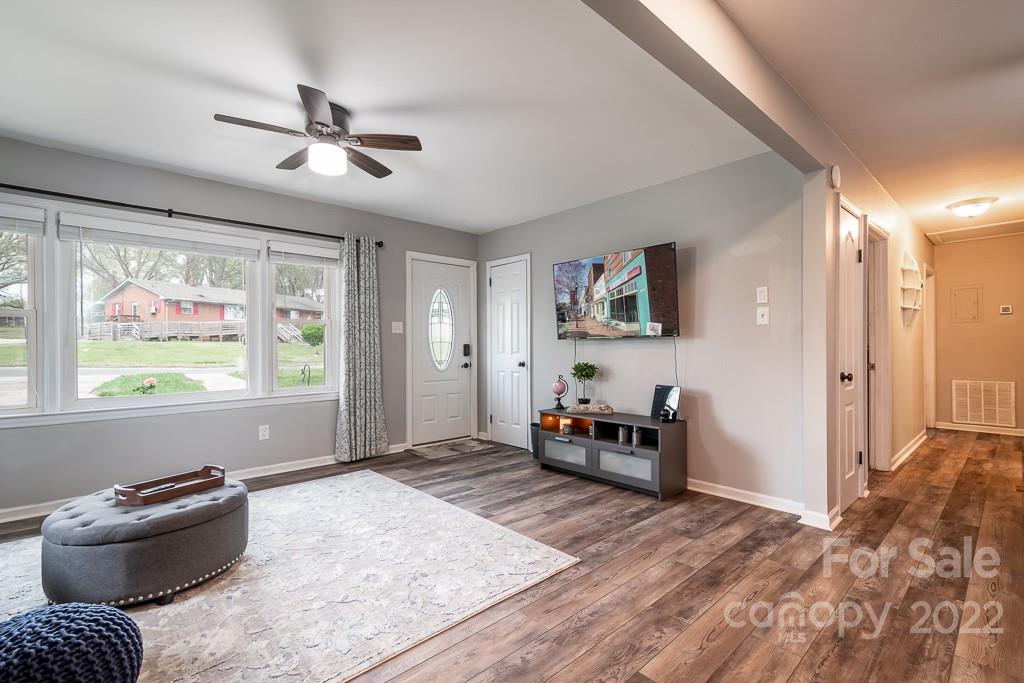 626 Westside Terrace, Unit 5 Davidson, NC 28036 - Photo 6 of 24 a bedroom with furniture and window