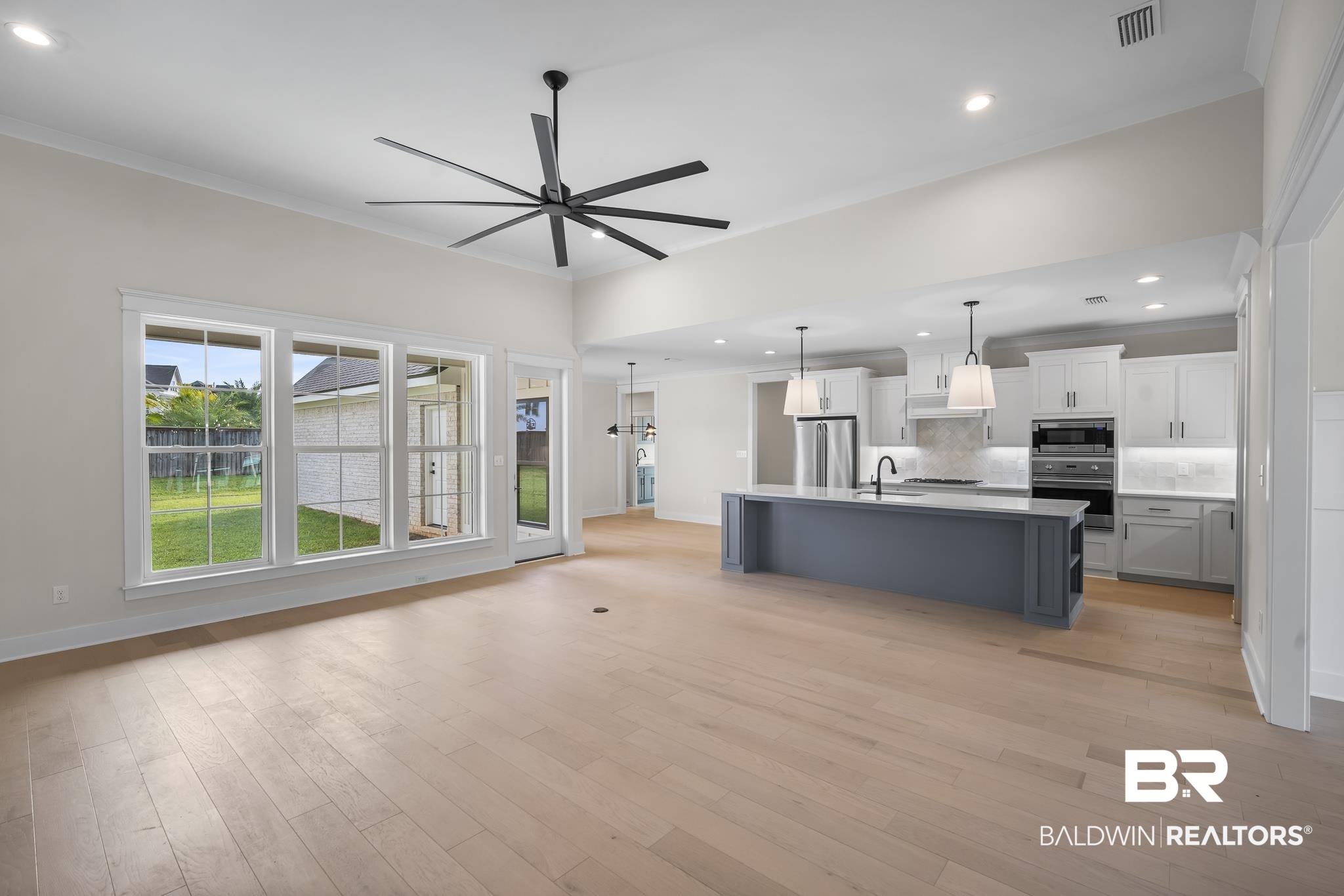 21826 Veranda Boulevard Fairhope, AL 36532 - Photo 6 of 42 Living room with recessed lighting, light wood-type flooring, ornamental molding, and ceiling fan