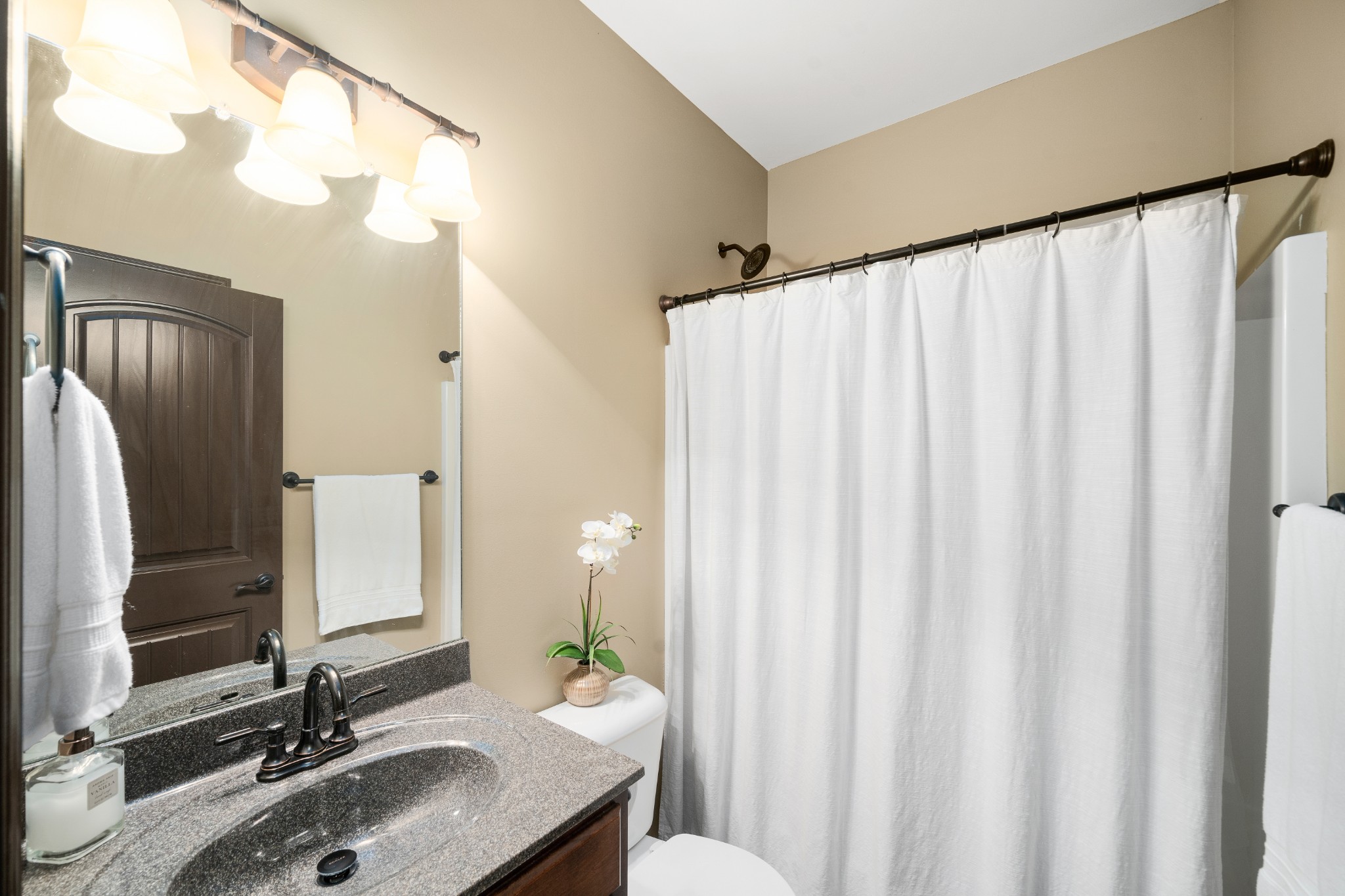 1439 Raven Road Clarksville, TN 37042 - Photo 23 of 28 a bathroom with a sink mirror and a toilet